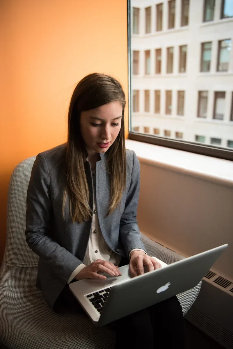 Student working on online course homework on a laptop